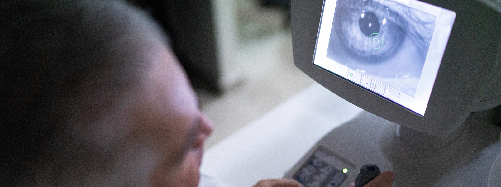 Doctor looks at image of eye